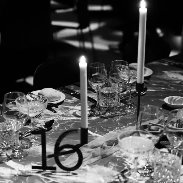 An elegant acrylic wedding table number at a formal Melbourne reception