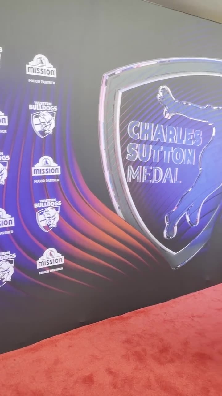 Branded photo booth backdrop with a red carpet at a Western Bulldogs awards night